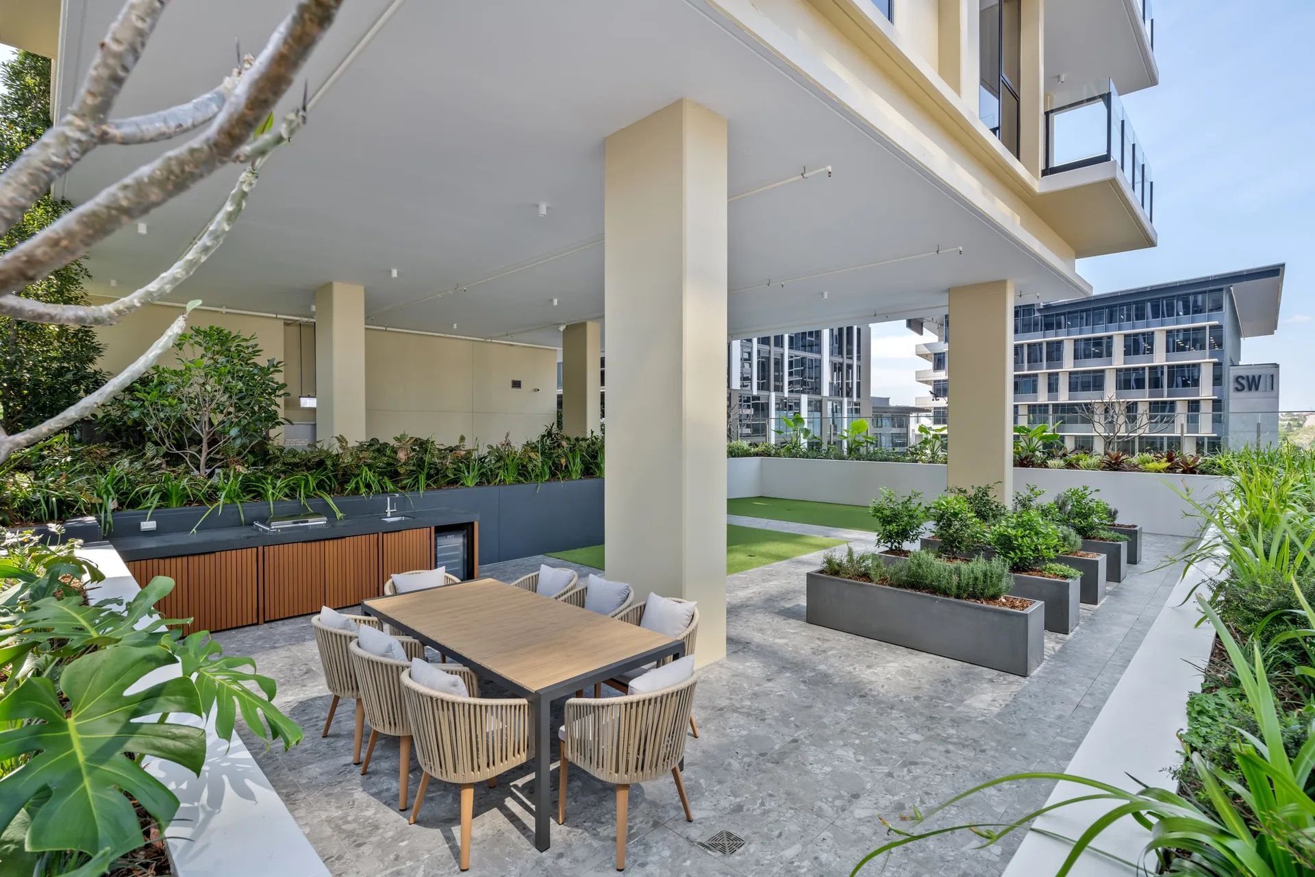 Podium terrace at Croft and Cremorne, South Brisbane, with the tower above