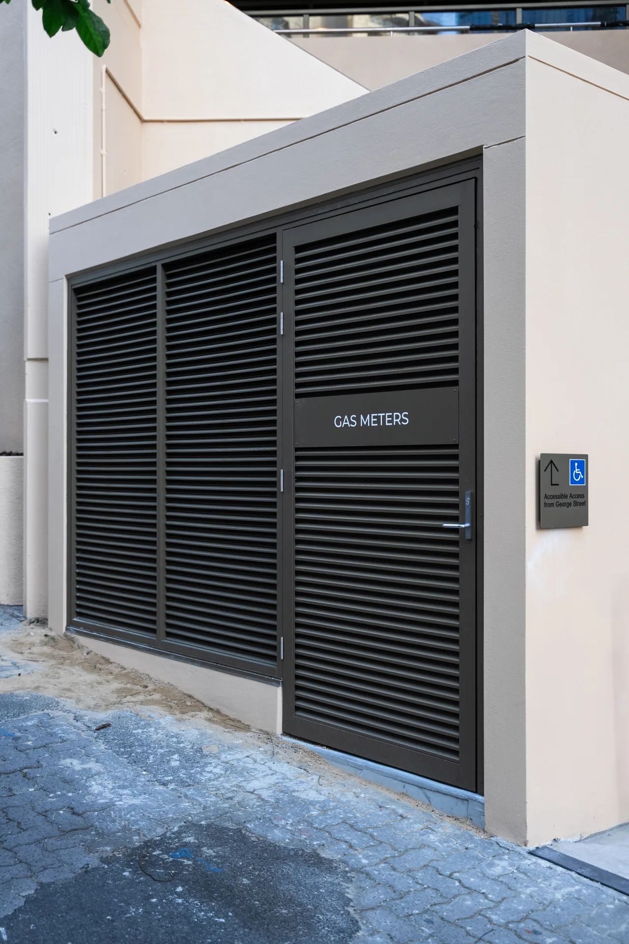 Black louvre gas-meter access doors, 41 George Street