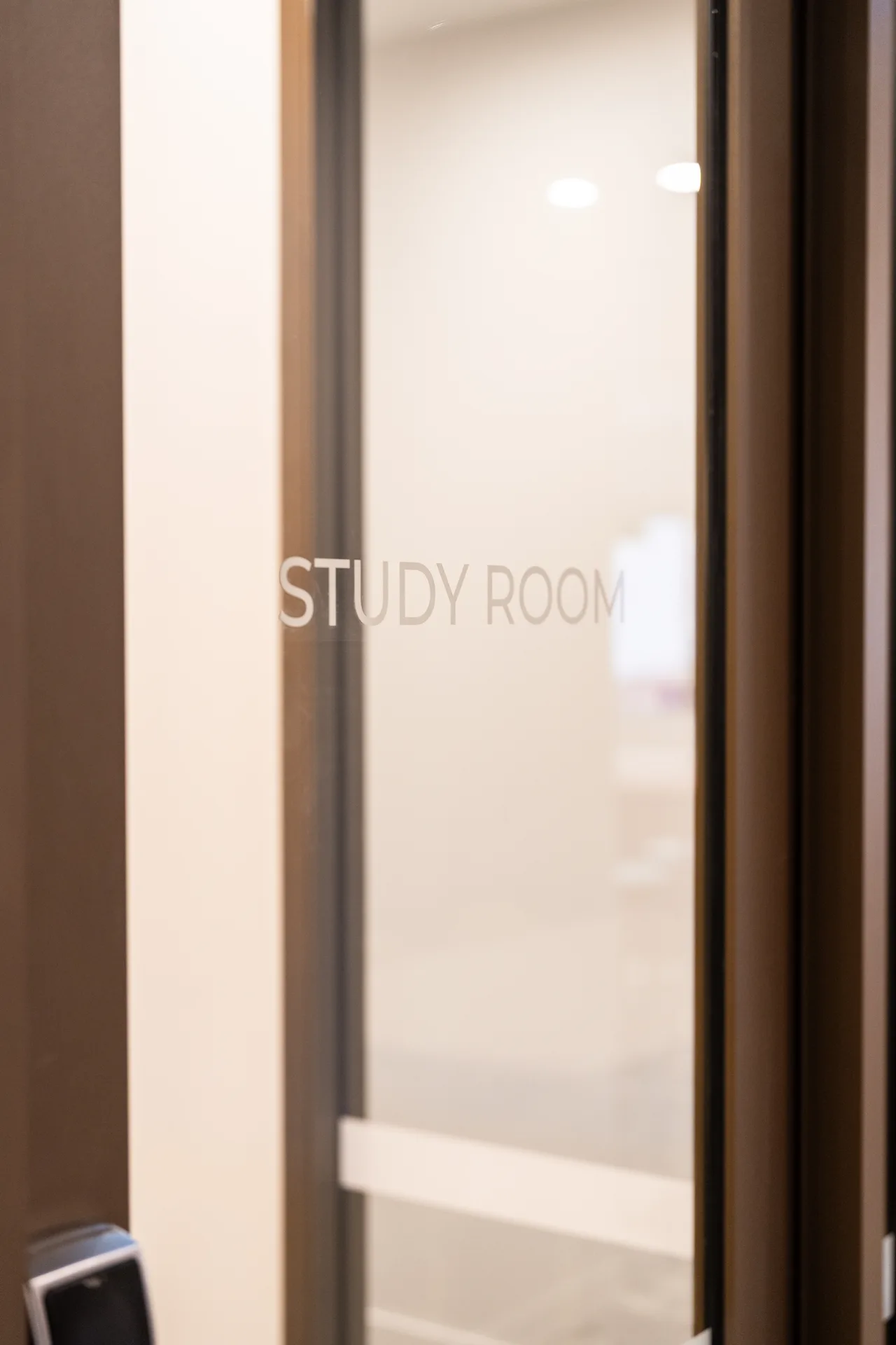 Aluminium-framed glass study-room door at 41 George Street